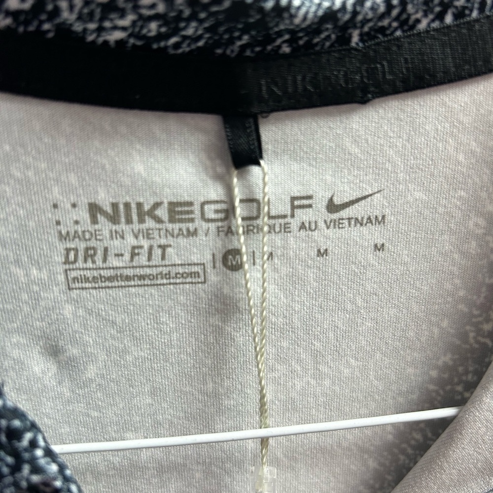 Women’s Nike Golf polo. Black with white speckle. Never worn new with tags.